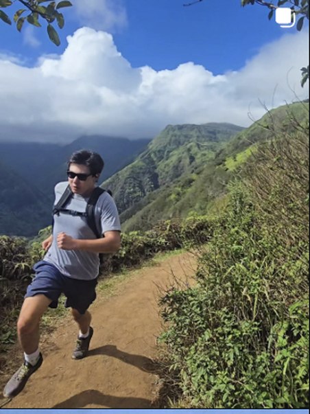 Trail running through green mountains