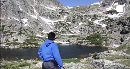 Taking in an alpine lake view