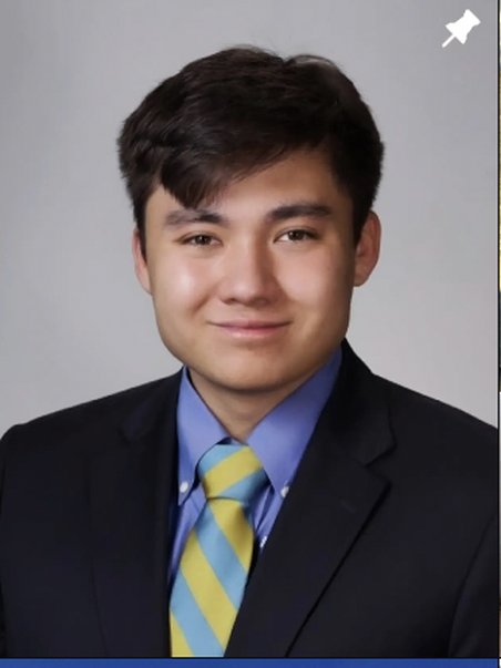 Professional headshot in a suit and tie