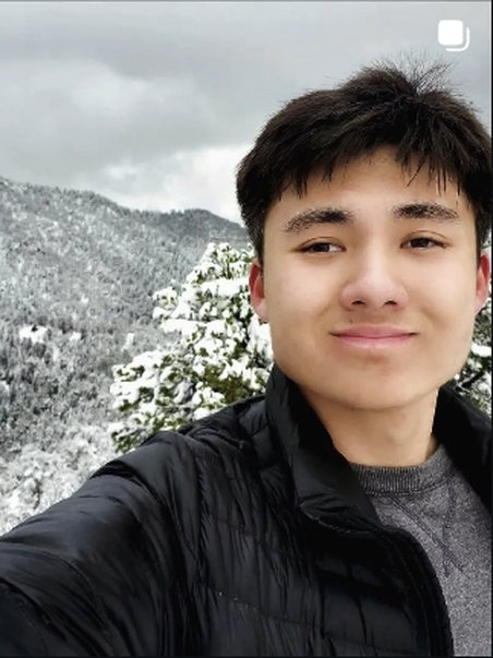 Selfie with a snowy mountain background